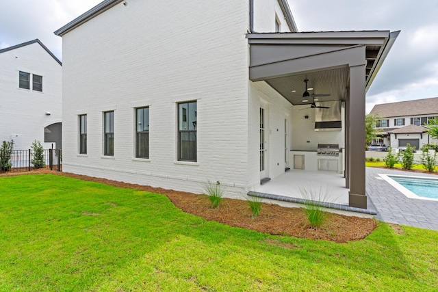 368 Ridgewalk Cir Lot 44B, Santa Rosa Beach, FL 32459 - back of property featuring area for grilling, a ceiling fan, a patio, and brick siding