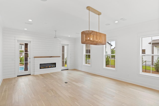 368 Ridgewalk Cir Lot 44B, Santa Rosa Beach, FL 32459 - unfurnished living room with light wood-style flooring, a glass covered fireplace, recessed lighting, and ceiling fan