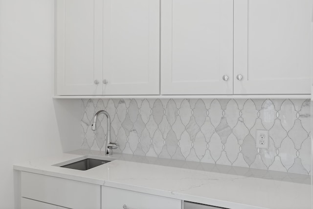 368 Ridgewalk Cir Lot 44B, Santa Rosa Beach, FL 32459 - kitchen featuring white cabinetry, decorative backsplash, and light stone countertops