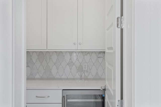 368 Ridgewalk Cir Lot 44B, Santa Rosa Beach, FL 32459 - kitchen with wine cooler, light countertops, white cabinets, and decorative backsplash