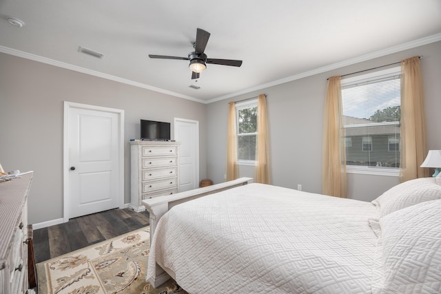 158 Johns Ln, Freeport, FL 32439 - bedroom with dark wood-style flooring, crown molding, and a ceiling fan