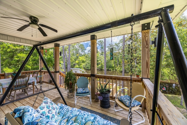 158 Johns Ln, Freeport, FL 32439 - deck featuring a ceiling fan and view of scattered trees