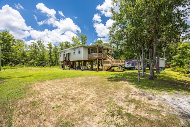 158 Johns Ln, Freeport, FL 32439 - view of green lawn featuring stairway, a wooden deck, and a ceiling fan