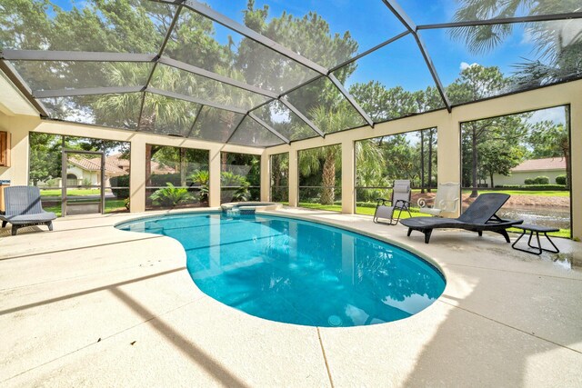 423 Maritime Ct, Destin, FL 32541 - view of pool featuring a patio, a pool with connected hot tub, and glass enclosure