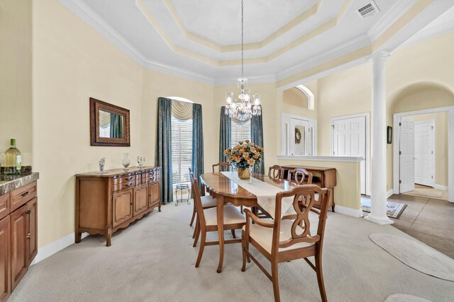 423 Maritime Ct, Destin, FL 32541 - dining room with crown molding, a raised ceiling, light colored carpet, a chandelier, and ornate columns