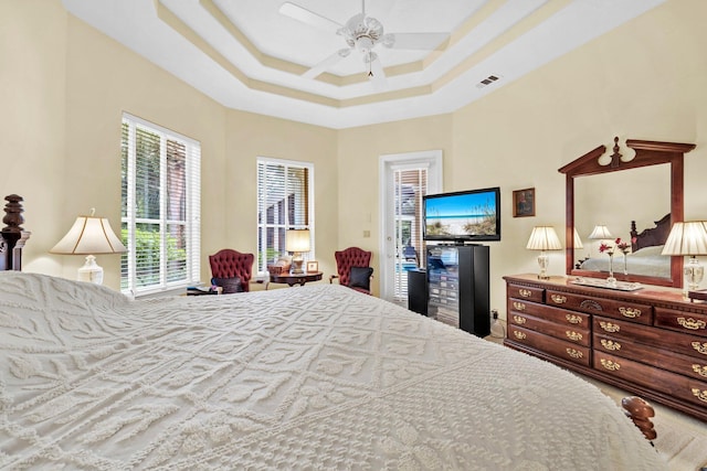 423 Maritime Ct, Destin, FL 32541 - bedroom featuring access to outside, a raised ceiling, and ceiling fan
