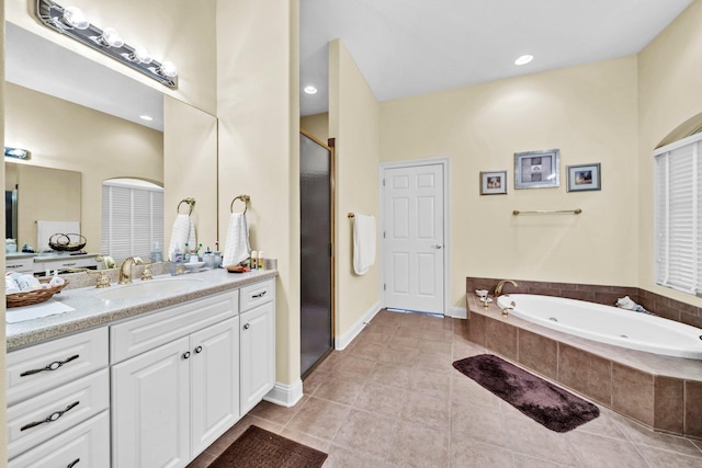 423 Maritime Ct, Destin, FL 32541 - bathroom featuring a shower stall, vanity, a tub with jets, and tile patterned flooring