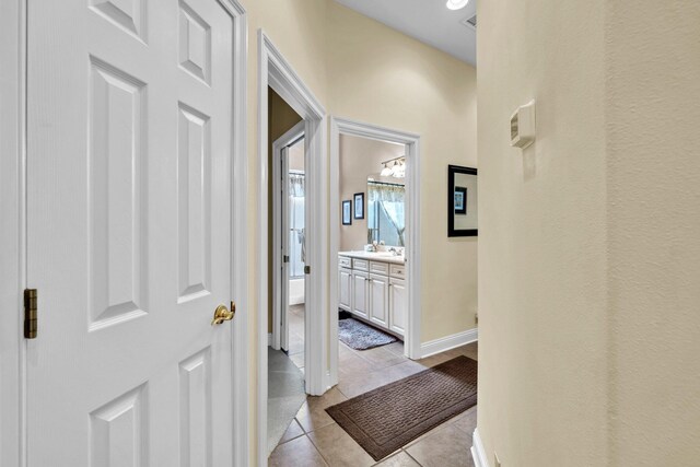423 Maritime Ct, Destin, FL 32541 - corridor featuring light tile patterned floors and baseboards