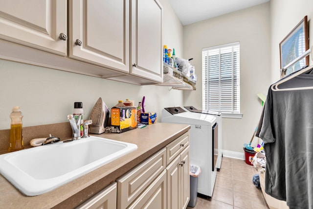 423 Maritime Ct, Destin, FL 32541 - laundry area featuring washer and clothes dryer, light tile patterned floors, and cabinet space