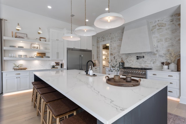 185 Dune Dr, Santa Rosa Beach, FL 32459 - kitchen with high end appliances, open shelves, decorative backsplash, custom range hood, and white cabinetry