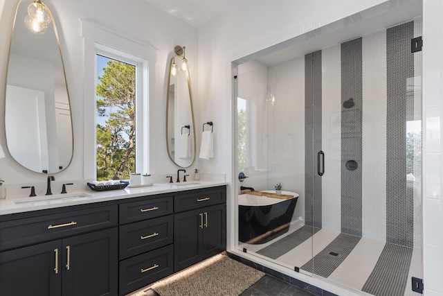 185 Dune Dr, Santa Rosa Beach, FL 32459 - bathroom with double vanity, a soaking tub, and a stall shower