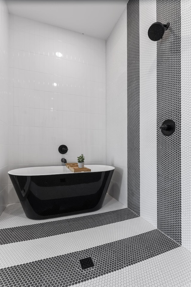 185 Dune Dr, Santa Rosa Beach, FL 32459 - full bathroom featuring tile walls, a freestanding bath, and a shower