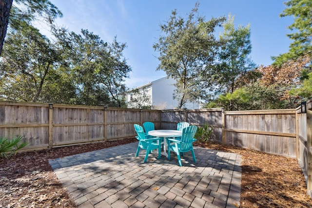 173 W Willow Mist Rd, Inlet Beach, FL 32461 - fenced backyard featuring a patio and outdoor dining area