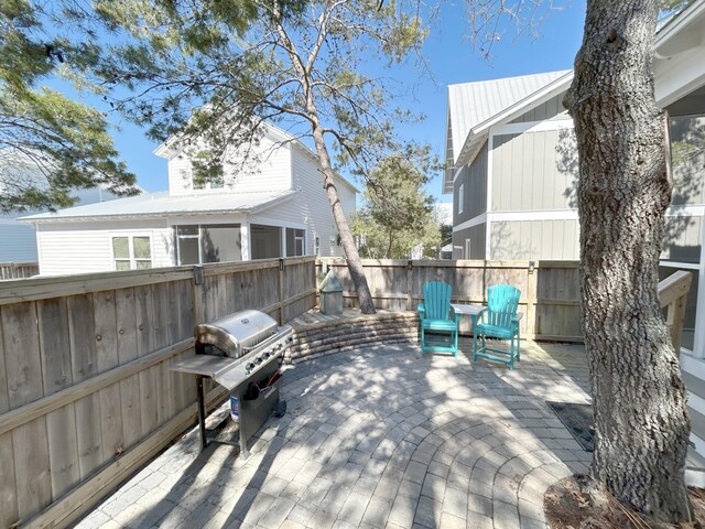 173 W Willow Mist Rd, Inlet Beach, FL 32461 - wooden terrace with a grill, a fenced backyard, and a patio