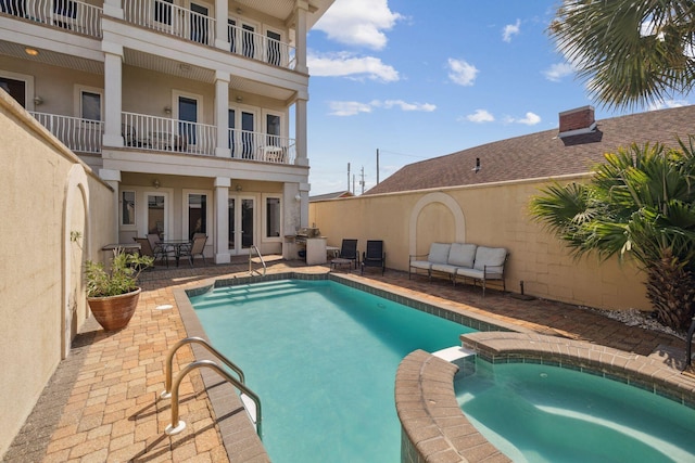 19108 Front Beach Rd Unit B, Panama City Beach, FL 32413 - view of pool featuring french doors, a patio, and a pool with connected hot tub