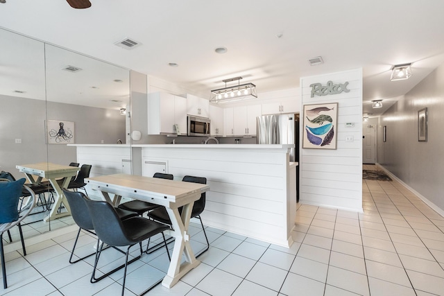 2606 Scenic Gulf Dr Unit 4206, Miramar Beach, FL 32550 - dining area with light tile patterned floors and baseboards