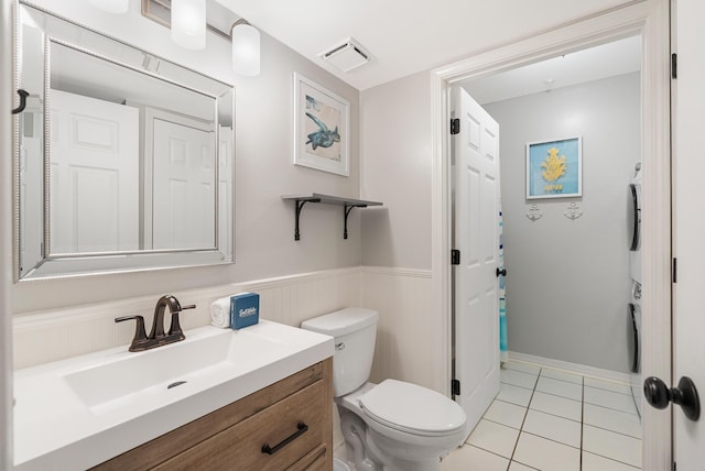 2606 Scenic Gulf Dr Unit 4206, Miramar Beach, FL 32550 - bathroom featuring vanity, tile patterned flooring, and a wainscoted wall