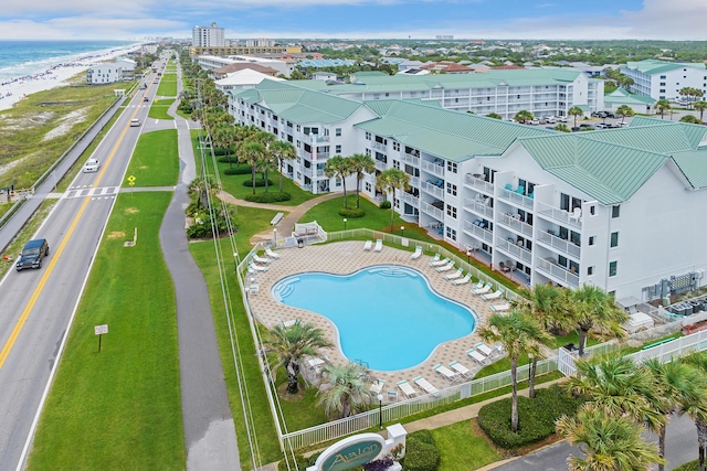 2606 Scenic Gulf Dr Unit 4206, Miramar Beach, FL 32550 - drone / aerial view of a pool and a nearby body of water
