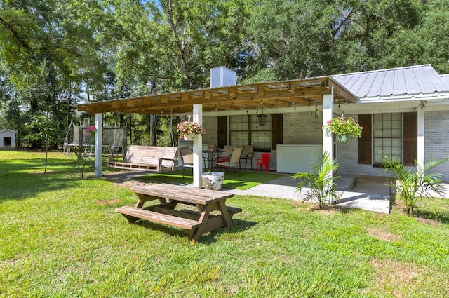 3774 Laird Rd, Crestview, FL 32539 - view of green lawn featuring a patio