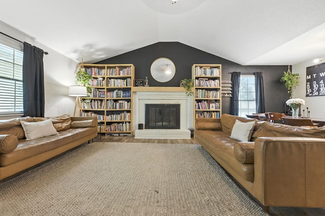 3774 Laird Rd, Crestview, FL 32539 - living area with wood finished floors, a fireplace, and vaulted ceiling