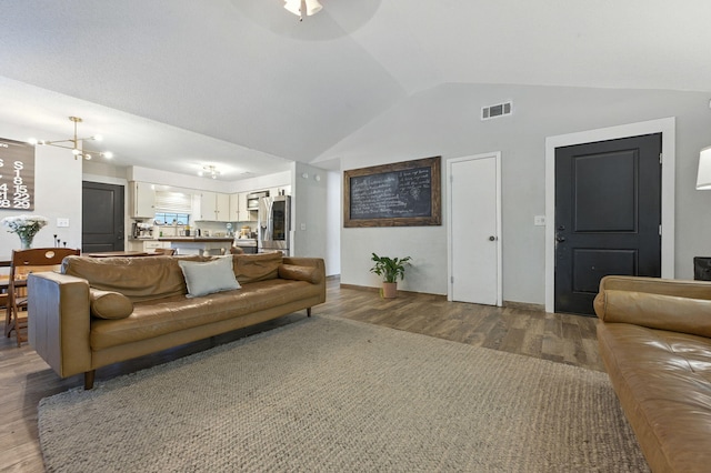 3774 Laird Rd, Crestview, FL 32539 - living area with wood finished floors, vaulted ceiling, and a ceiling fan