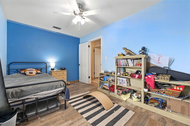 3774 Laird Rd, Crestview, FL 32539 - bedroom with wood finished floors and a ceiling fan