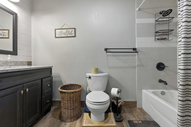 3774 Laird Rd, Crestview, FL 32539 - full bath with wood finished floors, vanity, shower / tub combo with curtain, and a textured wall