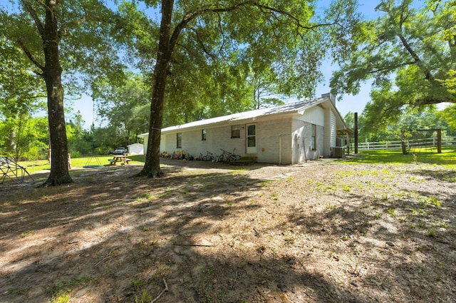 3774 Laird Rd, Crestview, FL 32539 - view of property exterior with a metal roof and concrete block siding