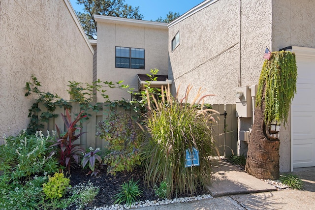 1090 5th Ave, Shalimar, FL 32579 - view of side of property with stucco siding and a garage