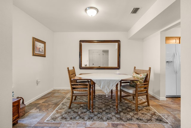 1090 5th Ave, Shalimar, FL 32579 - dining room featuring stone tile flooring