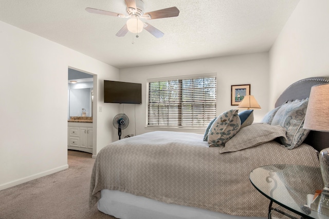 1090 5th Ave, Shalimar, FL 32579 - bedroom with light carpet, a ceiling fan, and ensuite bathroom