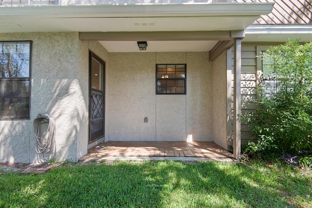 1090 5th Ave, Shalimar, FL 32579 - doorway to property featuring stucco siding