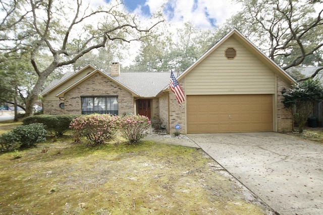 1262 Whitewood Way, Niceville, FL 32578 - single story home with brick siding, a chimney, concrete driveway, and an attached garage