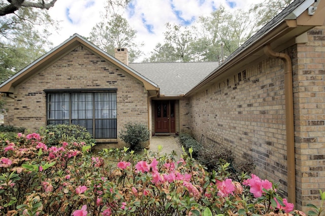1262 Whitewood Way, Niceville, FL 32578 - entrance to property featuring brick siding and a chimney