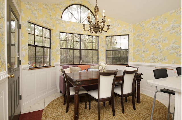 1262 Whitewood Way, Niceville, FL 32578 - dining area with a chandelier, a wainscoted wall, tile patterned floors, a decorative wall, and wallpapered walls