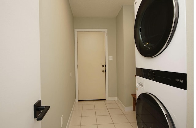 1262 Whitewood Way, Niceville, FL 32578 - washroom featuring stacked washer and clothes dryer and light tile patterned floors