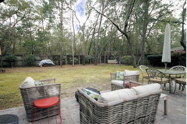 1262 Whitewood Way, Niceville, FL 32578 - fenced backyard with a patio, an outdoor hangout area, outdoor dining area, and view of scattered trees