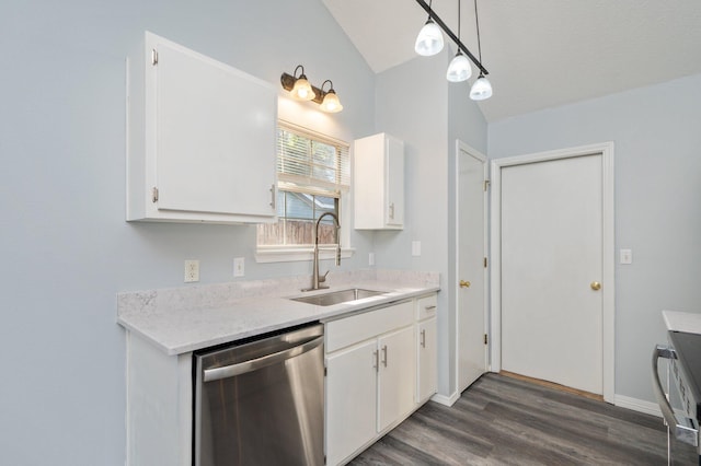 504 Shortwell Ave, Crestview, FL 32539 - kitchen featuring stainless steel dishwasher, lofted ceiling, light countertops, dark wood-style floors, and white cabinetry