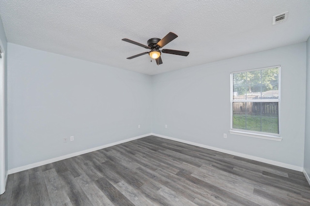 504 Shortwell Ave, Crestview, FL 32539 - unfurnished room with dark wood-type flooring, ceiling fan, and a textured ceiling