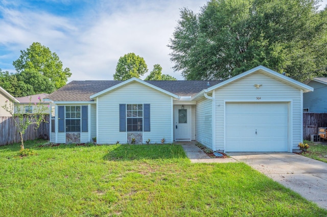 504 Shortwell Ave, Crestview, FL 32539 - ranch-style home featuring a garage, a shingled roof, and concrete driveway