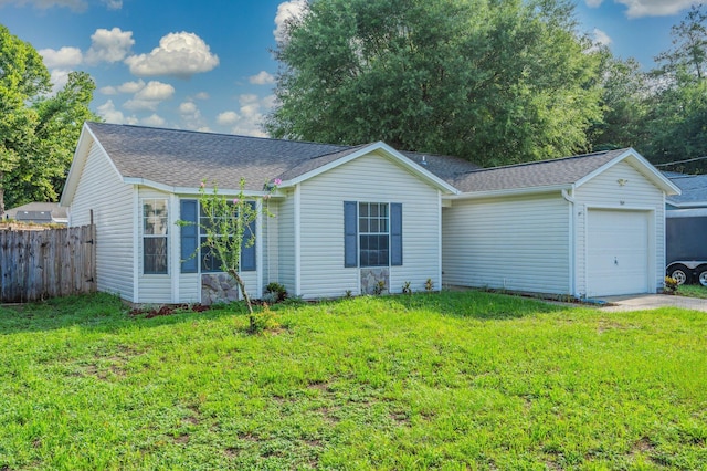 504 Shortwell Ave, Crestview, FL 32539 - ranch-style house featuring a garage, roof with shingles, and driveway