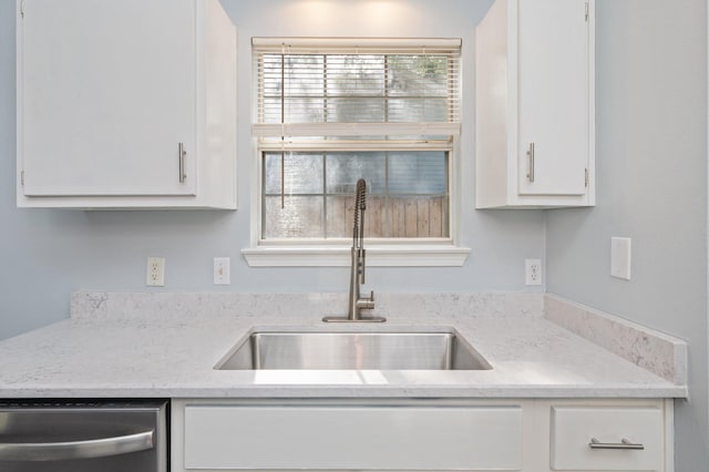 504 Shortwell Ave, Crestview, FL 32539 - kitchen with dishwasher and white cabinetry