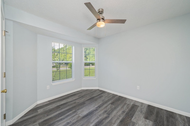 504 Shortwell Ave, Crestview, FL 32539 - empty room with dark wood finished floors, ceiling fan, and a textured ceiling