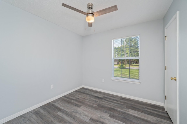 504 Shortwell Ave, Crestview, FL 32539 - spare room featuring dark wood-style flooring and a ceiling fan