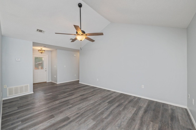 504 Shortwell Ave, Crestview, FL 32539 - empty room featuring dark wood finished floors, vaulted ceiling, and ceiling fan