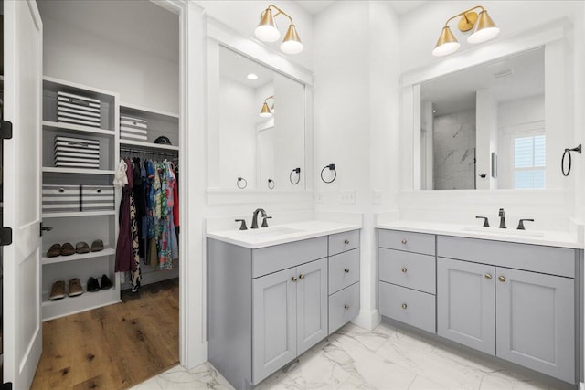 133 E Firethorn Cir, Inlet Beach, FL 32461 - bathroom with marble finish flooring, two vanities, a walk in closet, and recessed lighting