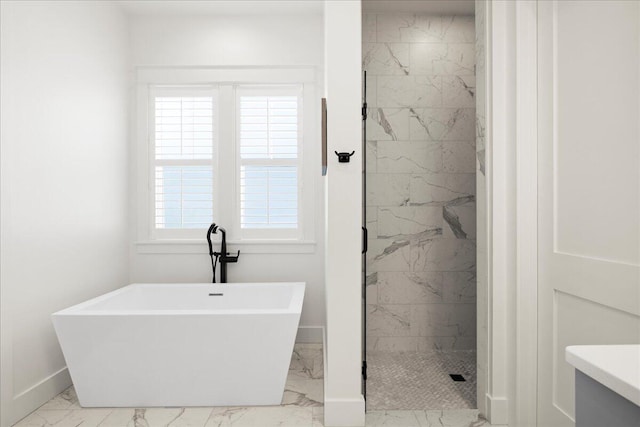 133 E Firethorn Cir, Inlet Beach, FL 32461 - bathroom featuring marble look tile flooring, a freestanding tub, a marble finish shower, and vanity