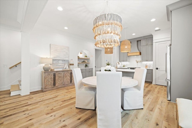 133 E Firethorn Cir, Inlet Beach, FL 32461 - dining room featuring a chandelier, light wood-type flooring, recessed lighting, stairs, and ornamental molding