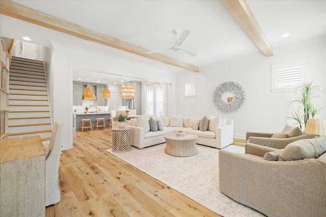 133 E Firethorn Cir, Inlet Beach, FL 32461 - living area with beamed ceiling, light wood-style flooring, stairs, a ceiling fan, and healthy amount of natural light