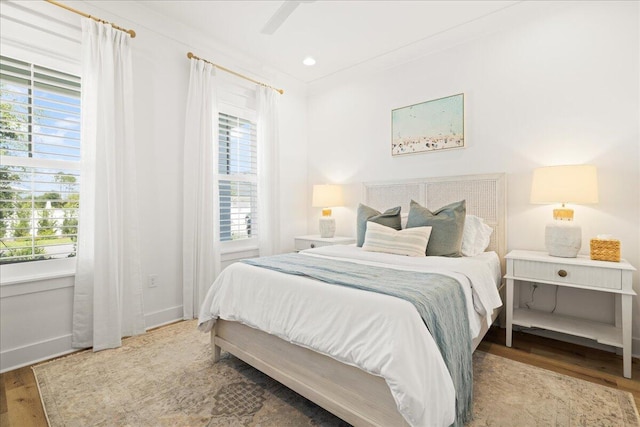 133 E Firethorn Cir, Inlet Beach, FL 32461 - bedroom with multiple windows and wood finished floors